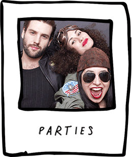 Three friends posing at a party, smiling happily.